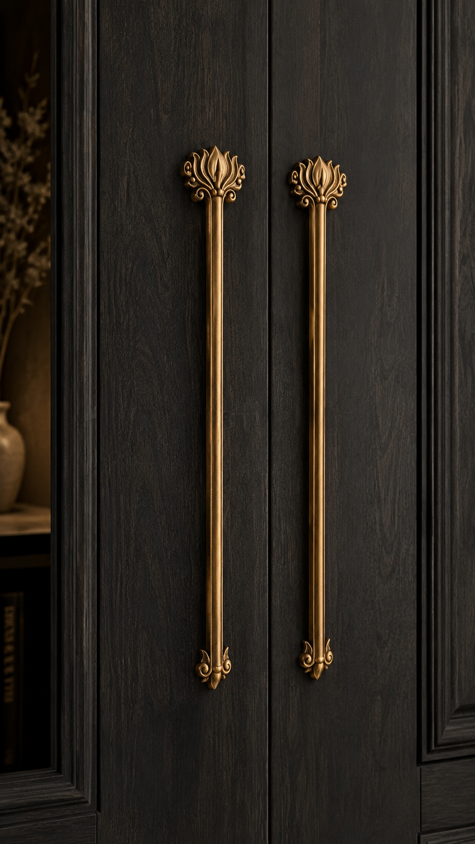 Hammered gold door handle with slim curved shape, antique brass texture, wooden door surface, and luxury modern hardware detail