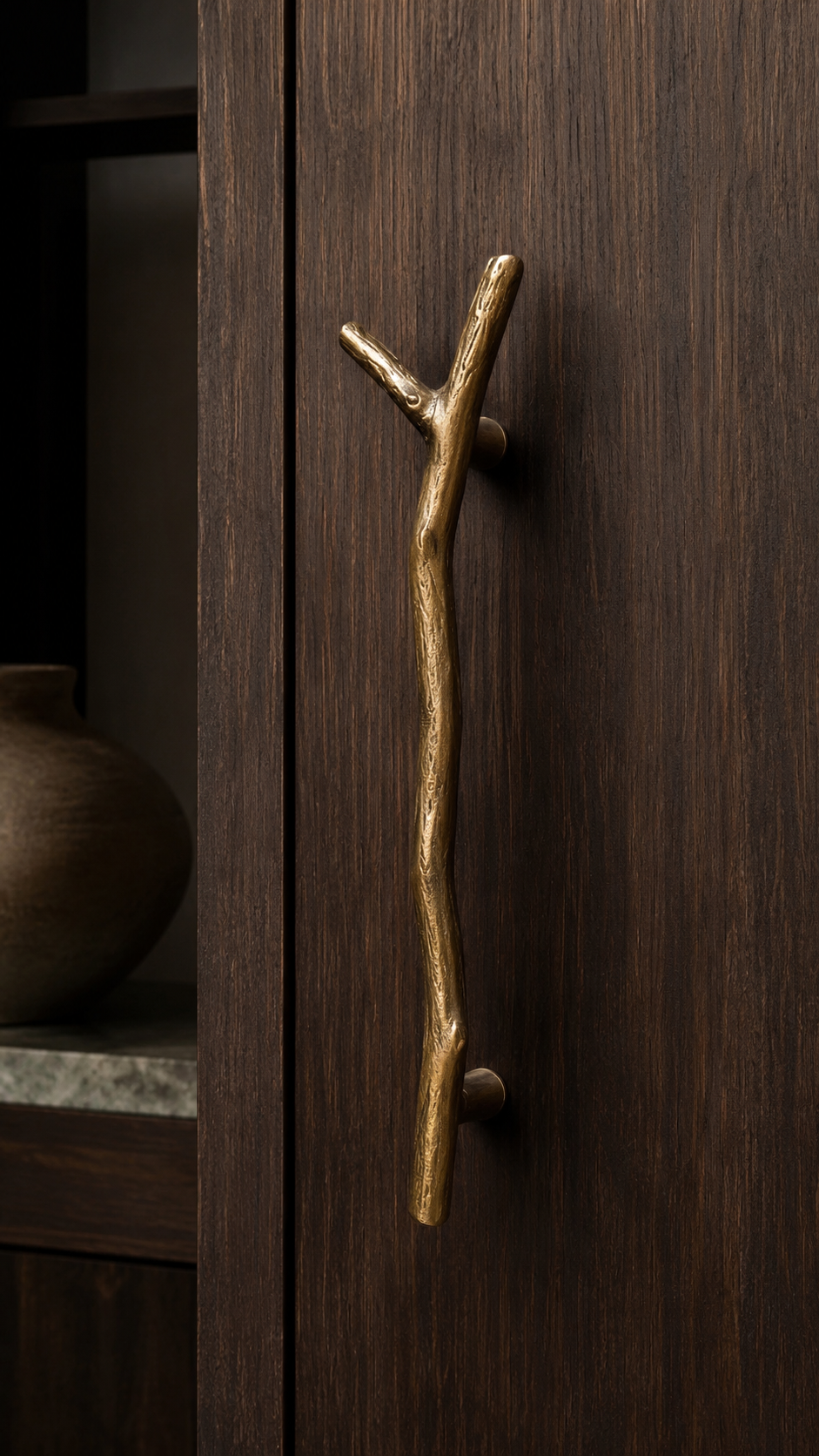 Luxury gold lever door handle with long decorative backplate, geometric pattern, keyhole design, and black modern door styling