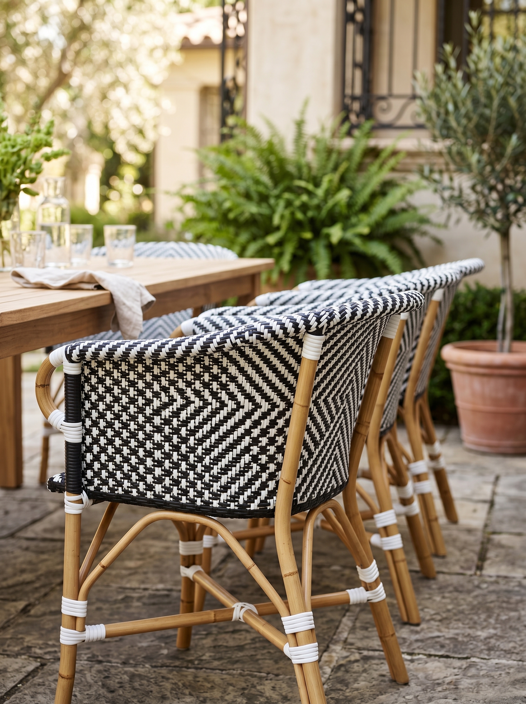 Turquoise poolside outdoor dining chair with metal frame, wooden seat, patio table, deck flooring, and swimming pool view