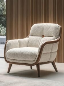 Pink flower-inspired armchair with blush upholstery, petal-shaped cushions, gold base, faux fur throw, marble side table, and soft decor