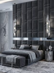Plum and burgundy glam bedroom with velvet bed, arched feature wall, LED strips, crystal chandelier, globe pendant lights, and vanity corner